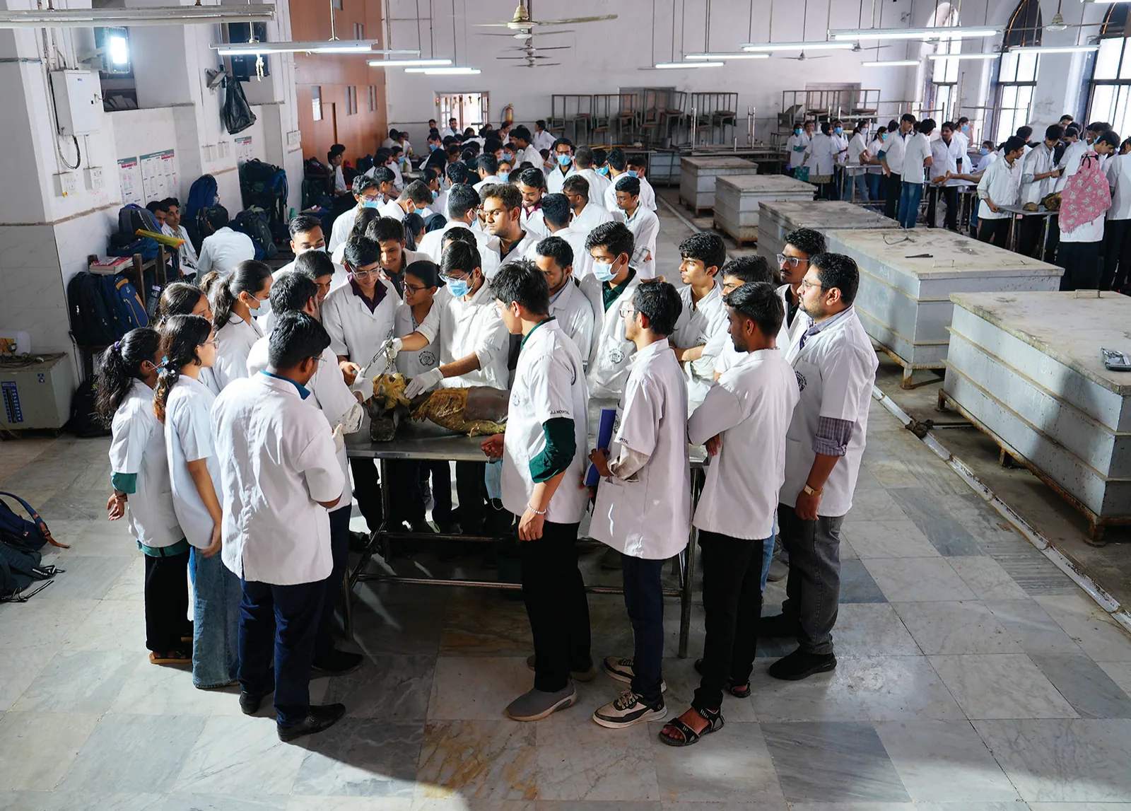Students in an anatomy class during a practical lecture on dissection