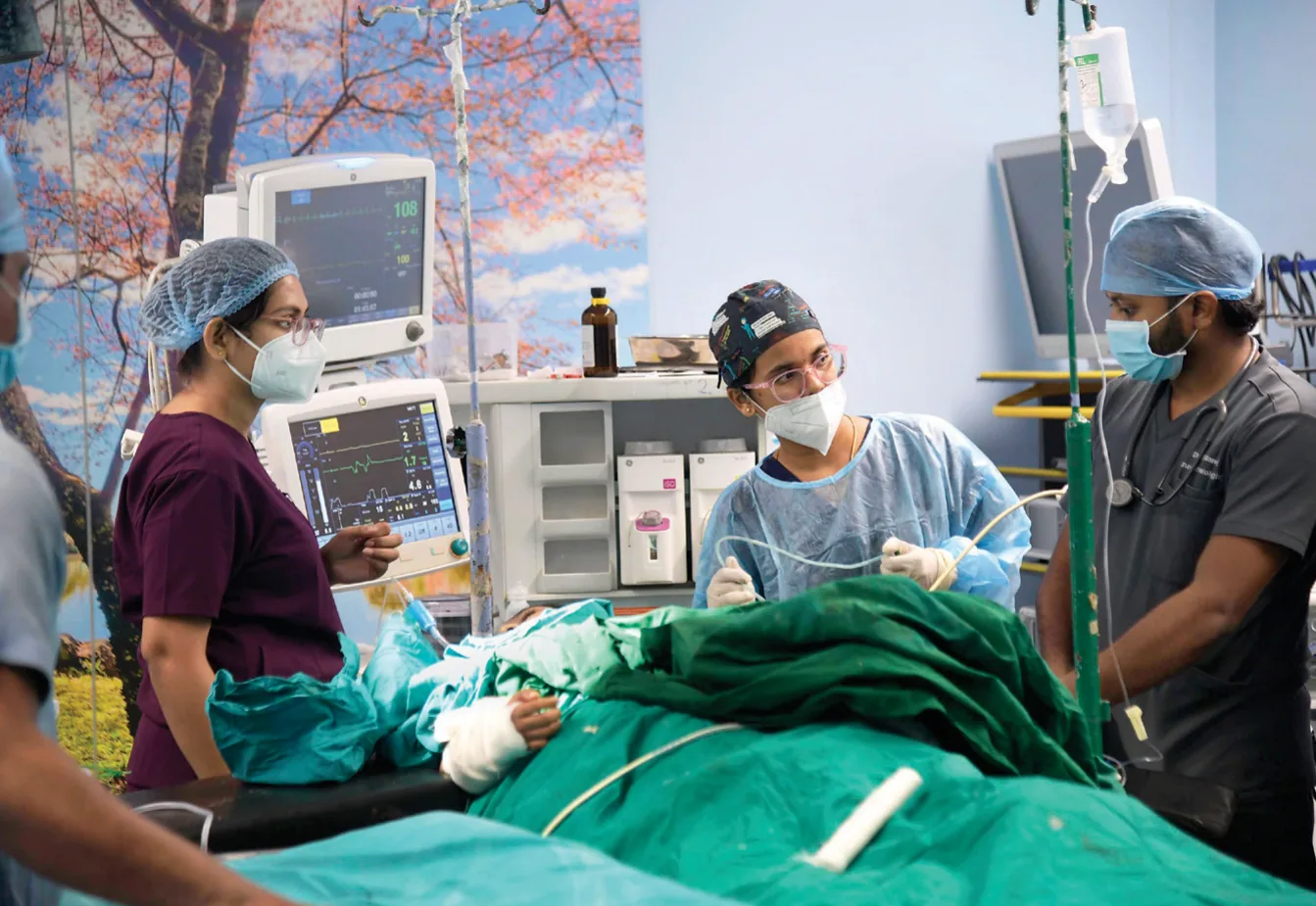 A practical class underway in the pathology department (Above, left) A patient is examined before admission in the ophthalmology ward (Above, right) Staff care for a patient in a surgery ward