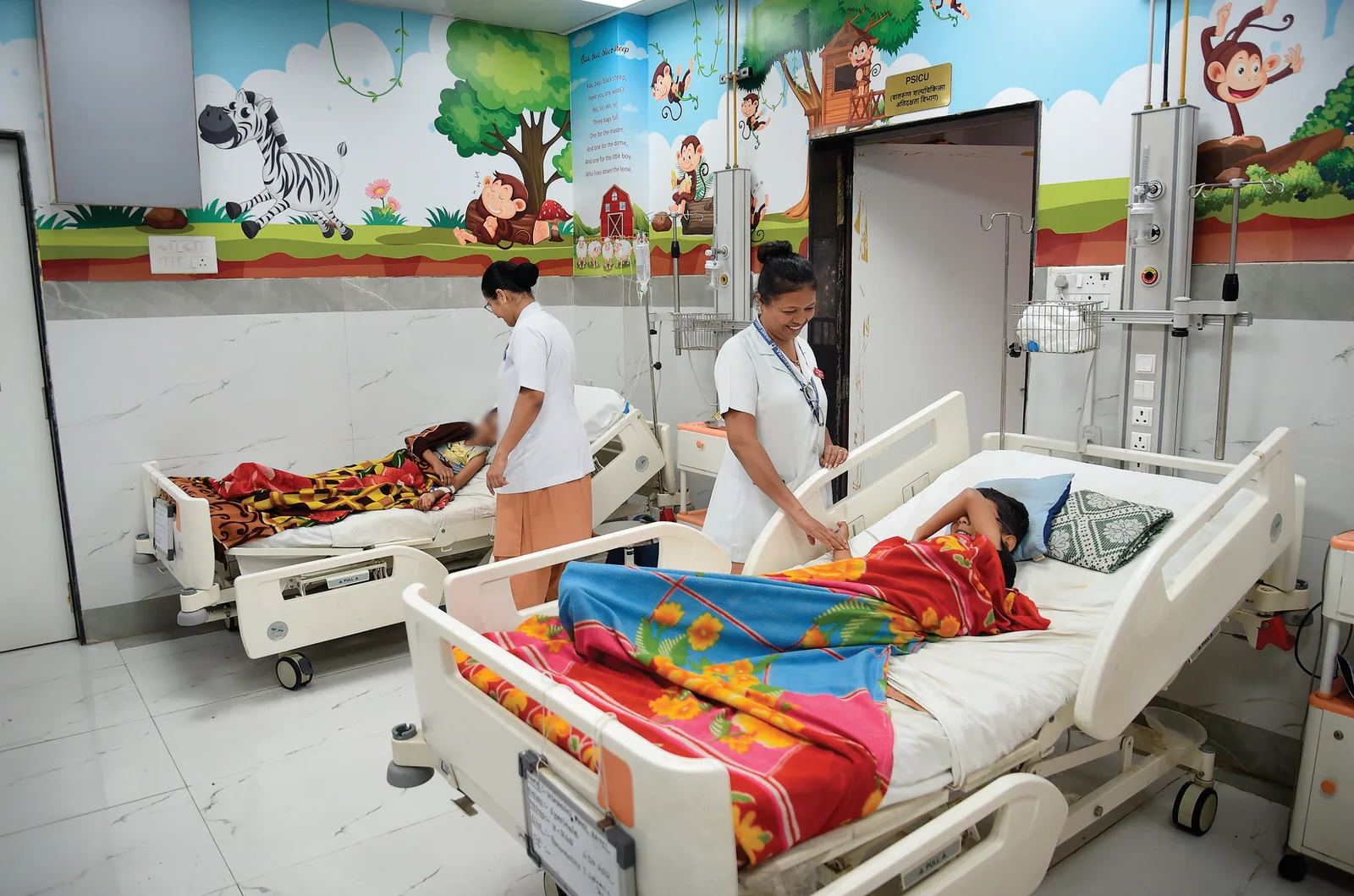 The interiors of a paediatric surgery ward (Right) In the nursing home, nurses prepare to start their shift