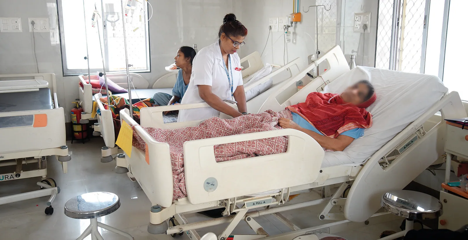 The main administrative building in the JJ Hospital complex (Above, right) Nurses on duty