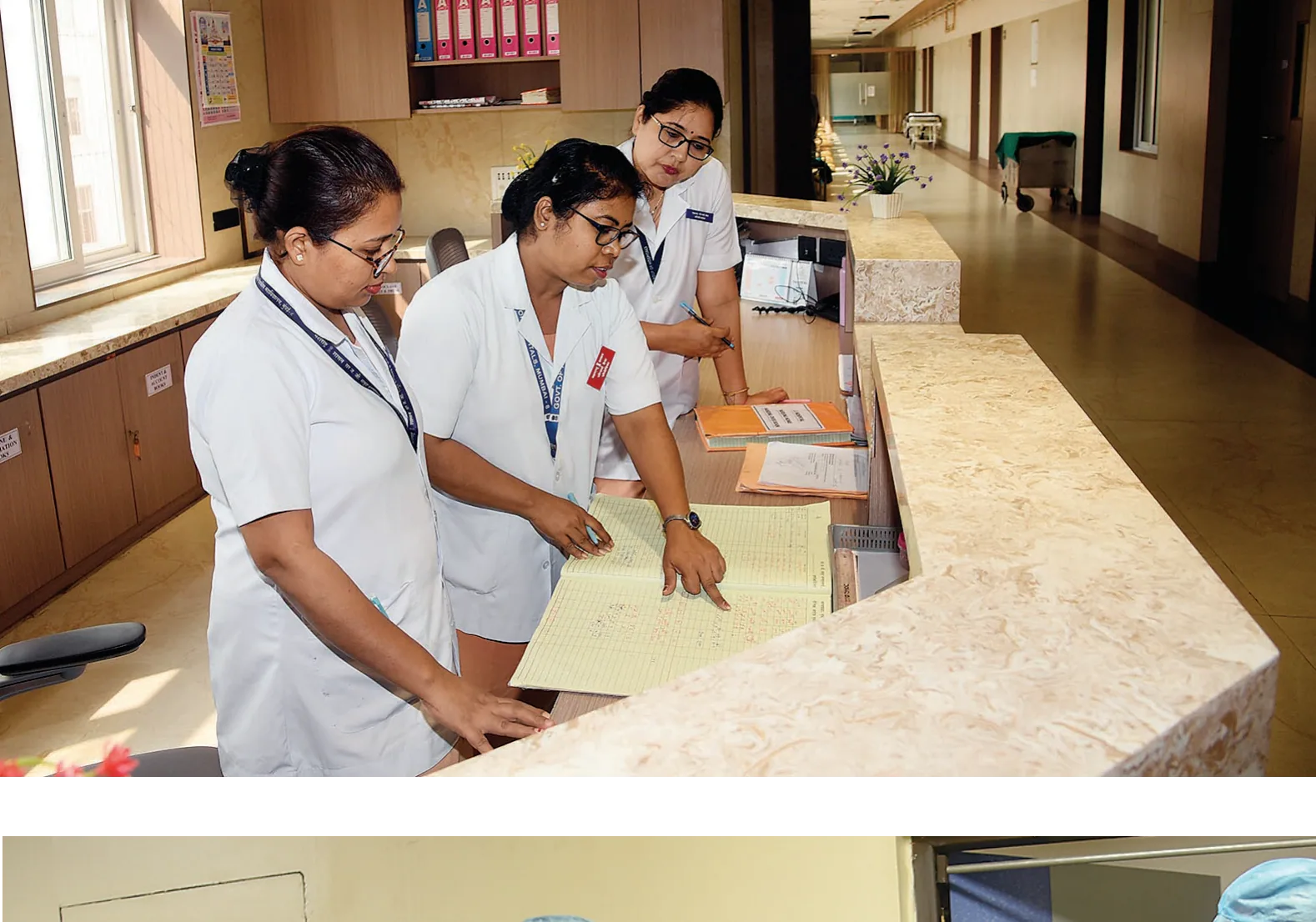 Medical staff on duty. Every shift change is marked by conversation and documentation.